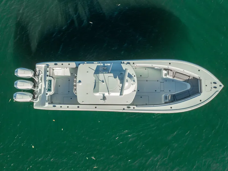 Slide: The Image of Aerial view of 2023 Yellowfin 36 boat on clear green water. - 17