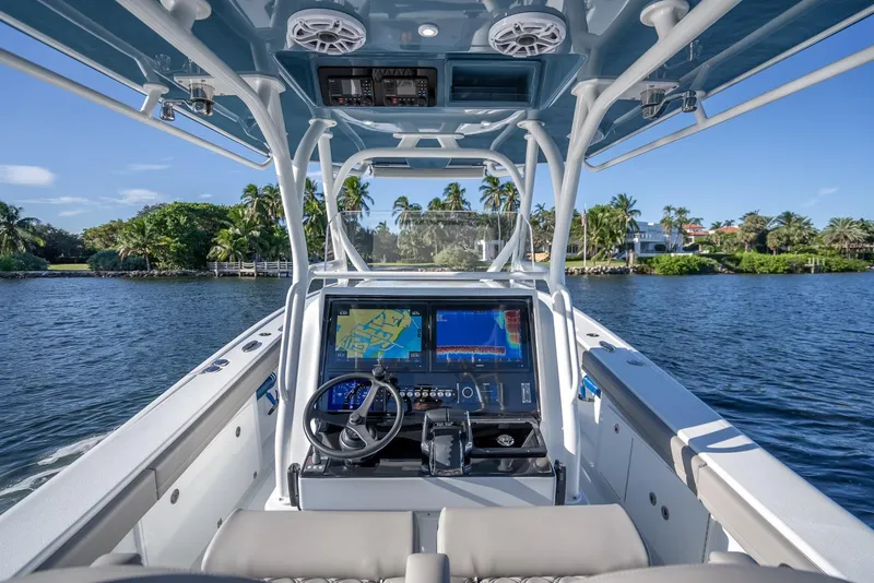 Slide: The Image of 2023 Yellowfin 36 boat cockpit with advanced navigation system on a sunny day. - 19