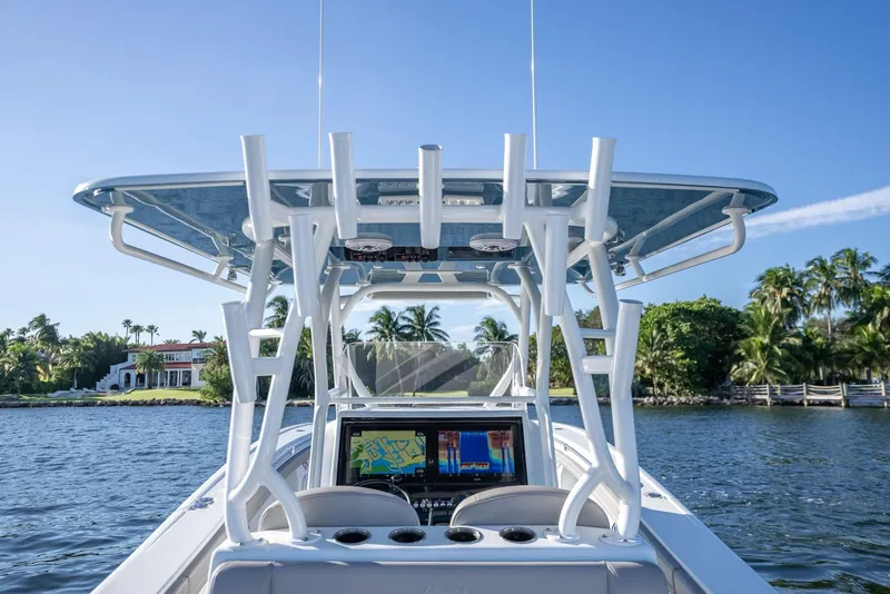 Slide: The Image of 2023 Yellowfin 36 boat with advanced navigation system on a sunny day. - 23