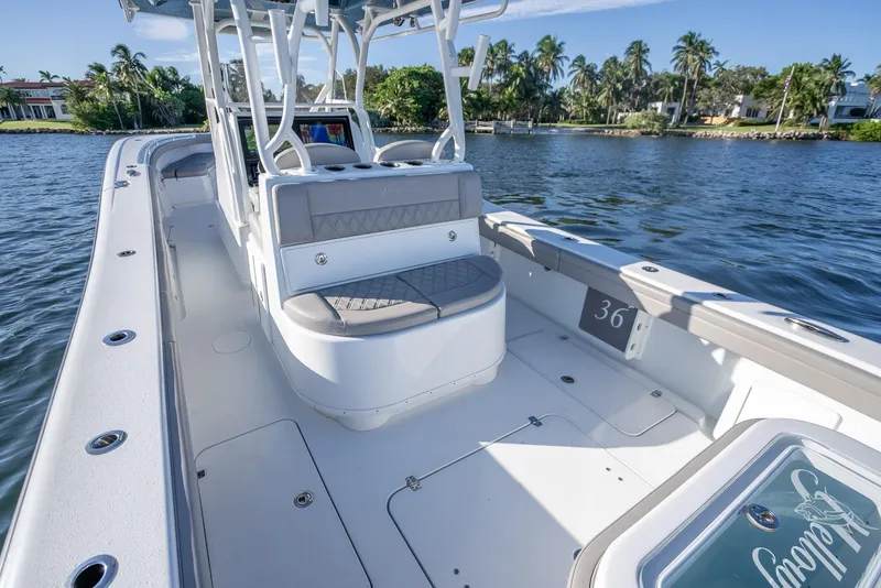 Slide: The Image of 2023 Yellowfin 36 boat on water, featuring spacious deck and seating. - 33