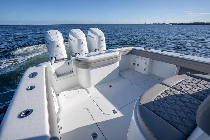 Slide: The Image of 2023 Yellowfin 36 boat with triple engines on open water. - 34