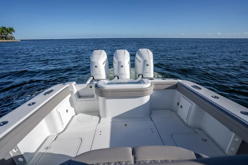 Slide: The Image of 2023 Yellowfin 36 boat with triple engines on open water. - 35