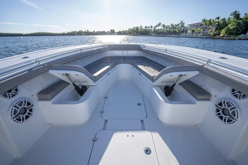 Slide: The Image of 2023 Yellowfin 36 boat interior with open storage compartments on a sunny day. - 36