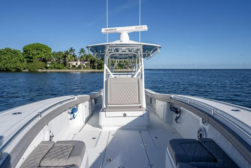 Slide: The Image of 2023 Yellowfin 36 boat on calm water, featuring spacious deck and modern design. - 41