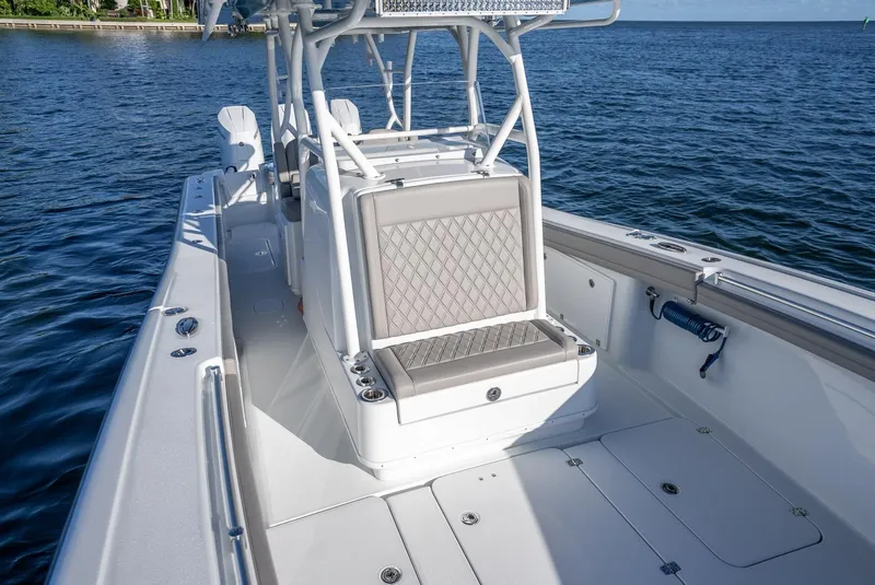 Slide: The Image of 2023 Yellowfin 36 boat interior with seating, on calm blue water. - 43