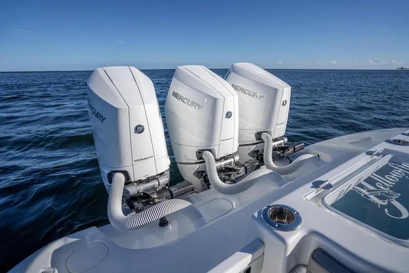 Slide: The Image of 2023 Yellowfin 36 boat with triple Mercury outboard engines on open water. - 44