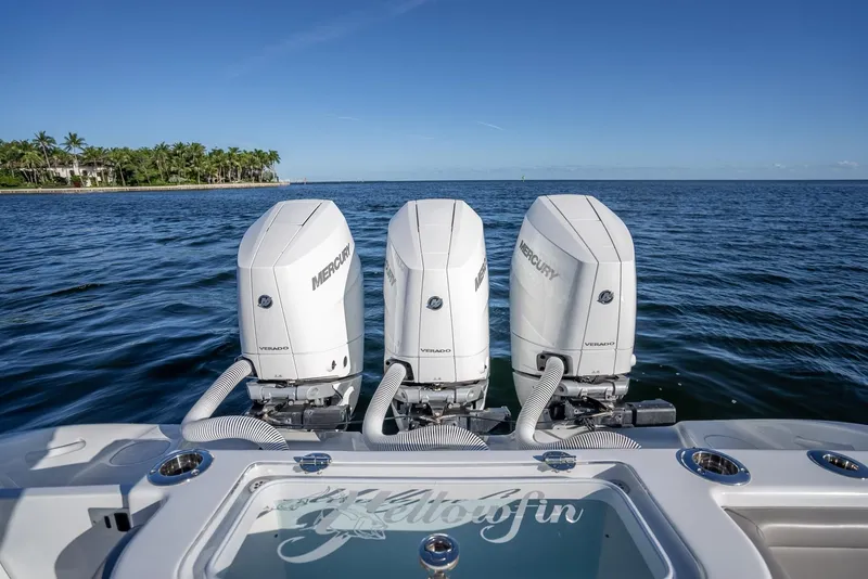 Slide: The Image of 2023 Yellowfin 36 boat with triple Mercury engines on open water. - 45