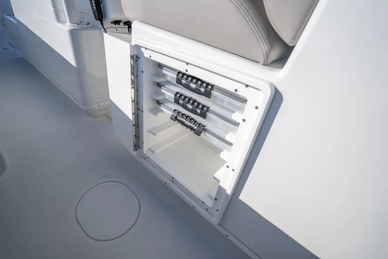 Slide: The Image of 2023 Yellowfin 36 boat storage compartment with rod holders and sleek design. - 47