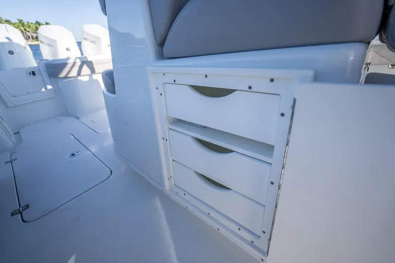 Slide: The Image of 2023 Yellowfin 36 boat interior with storage drawers and seating. - 49