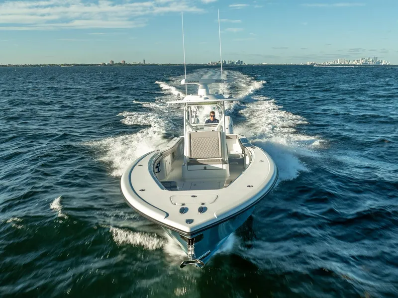 Slide: The Image of 2023 Yellowfin 36 boat cruising on open water under clear skies. - 5