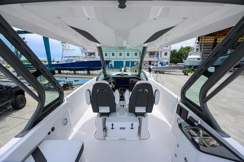 Slide: The Image of 2026 Monterey Elite 27 OB boat interior with dual seats and modern dashboard. - 20