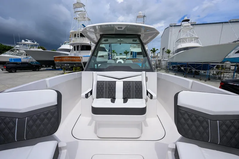 Slide: The Image of 2026 Monterey Elite 27 OB boat interior with luxurious seating and sleek design. - 3