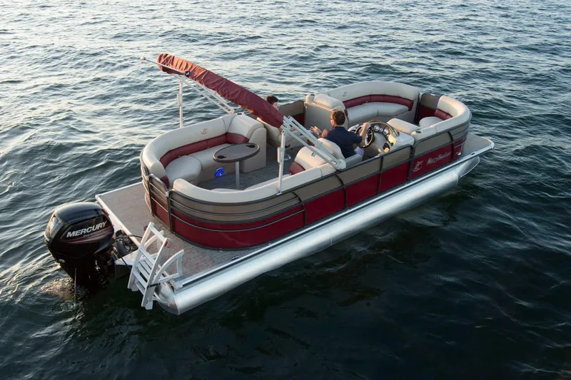 Slide: The Image of 2018 Misty Harbor 2285 Biscayne Bay CU pontoon boat on water, featuring red and beige seating. - 2