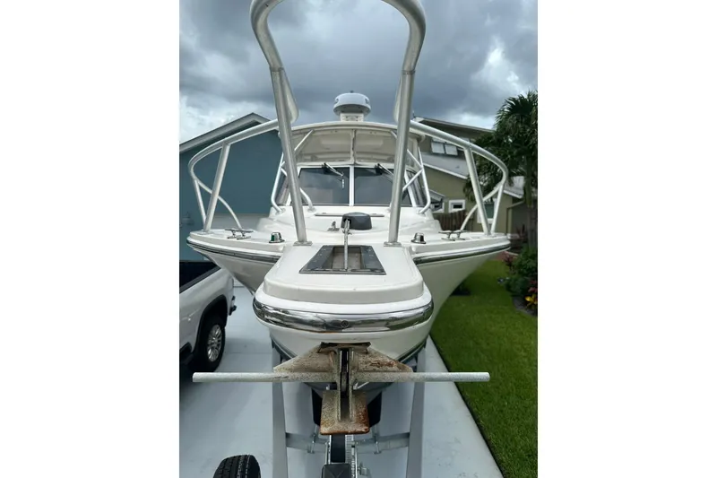 Slide: The Image of 2003 Albemarle 268 Express Fisherman boat on trailer, parked in driveway. - 13