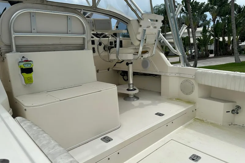 Slide: The Image of 2003 Albemarle 268 Express Fisherman boat interior with seating and steering area. - 15