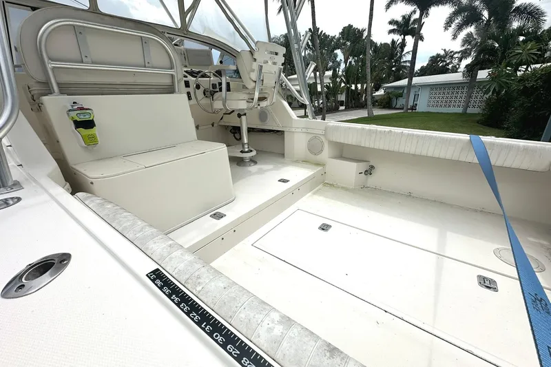 Slide: The Image of 2003 Albemarle 268 Express Fisherman boat interior with seating and steering area. - 16