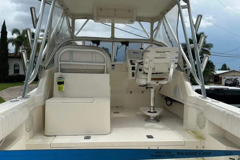 Slide: The Image of 2003 Albemarle 268 Express Fisherman boat interior with captain's chair and control panel. - 18