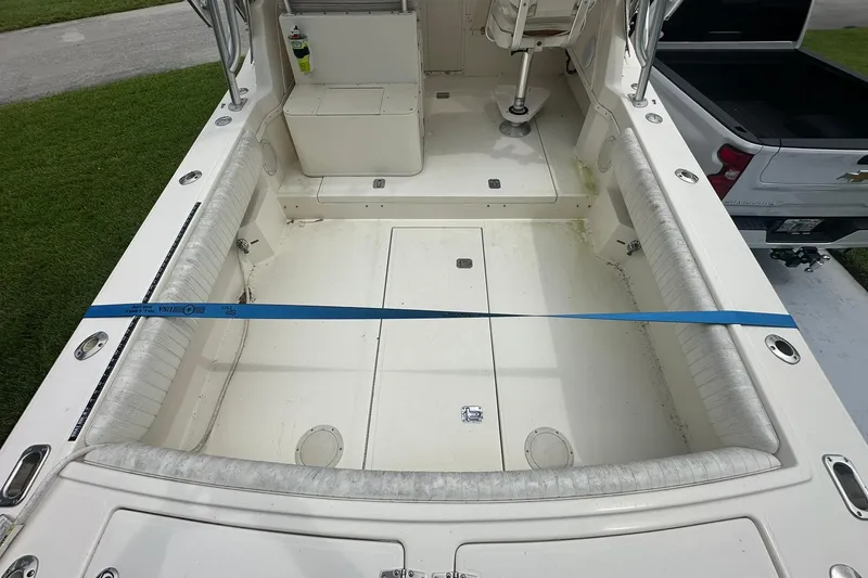 Slide: The Image of 2003 Albemarle 268 Express Fisherman boat interior with seating and storage compartments. - 20