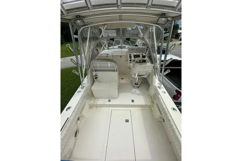 Slide: The Image of 2003 Albemarle 268 Express Fisherman boat interior with helm and seating area. - 21