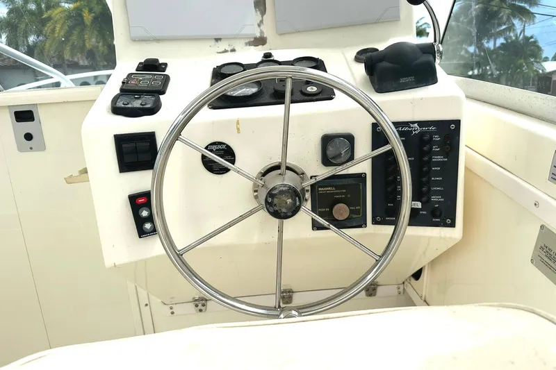 Slide: The Image of 2003 Albemarle 268 Express Fisherman helm with steering wheel and control panel. - 23
