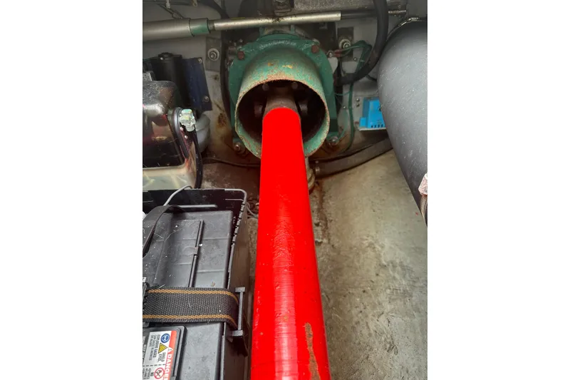 Slide: The Image of Engine compartment of 2003 Albemarle 268 Express Fisherman with red shaft and battery. - 30
