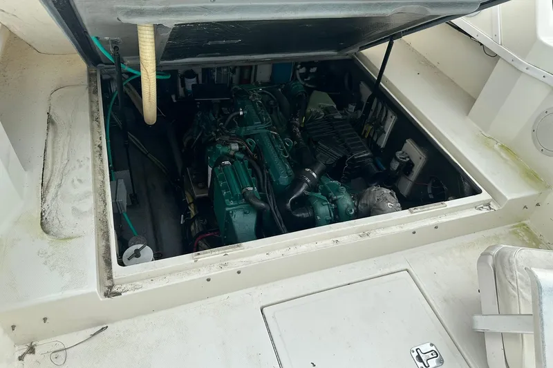 Slide: The Image of Engine compartment of a 2003 Albemarle 268 Express Fisherman boat, showcasing marine engine. - 31