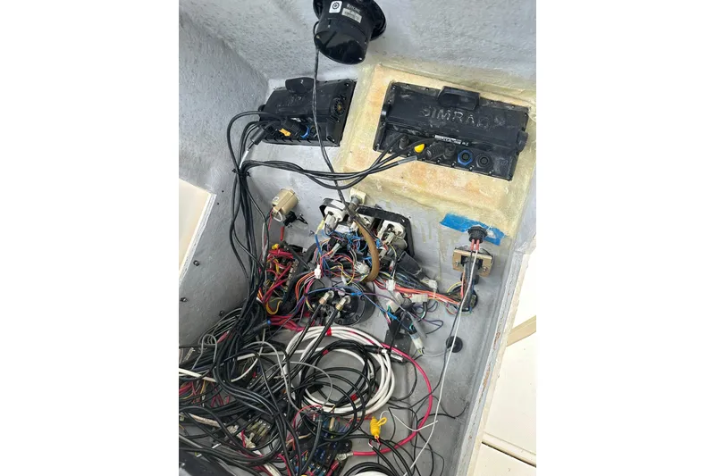 Slide: The Image of Electrical wiring and components inside a 2003 Albemarle 268 Express Fisherman boat. - 32