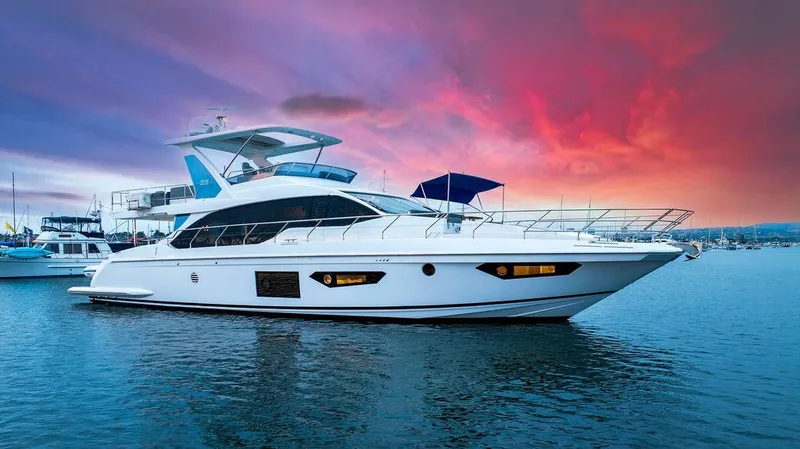 The Image of 2020 Azimut 66 yacht on water at sunset with vibrant sky. - 0