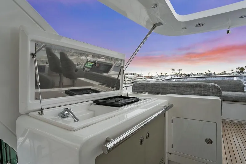 Slide: The Image of Luxury Azimut 66 yacht deck with kitchenette, sunset view, 2020 model. - 11