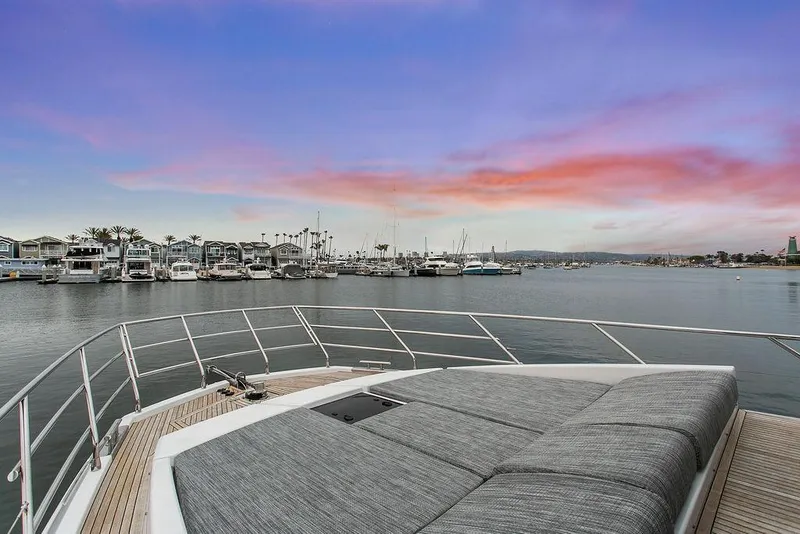 Slide: The Image of 2020 Azimut 66 yacht deck with sunset harbor view. - 12