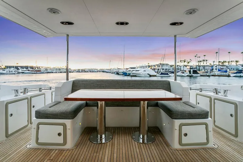 Slide: The Image of Luxury Azimut 66 yacht deck with seating, overlooking marina at sunset, 2020 model. - 14