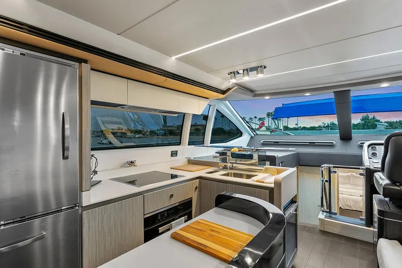 Slide: The Image of Luxurious interior of a 2020 Azimut 66 yacht with modern kitchen and scenic views. - 16