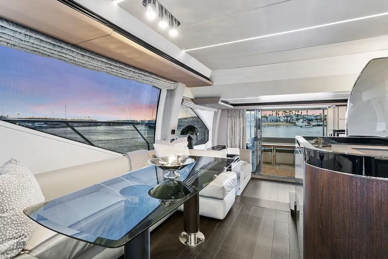 Slide: The Image of Luxurious interior of 2020 Azimut 66 yacht with elegant dining area and scenic views. - 18