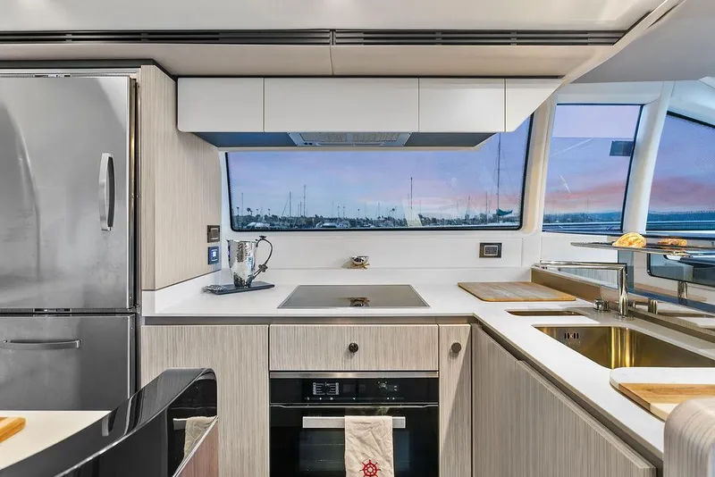 Slide: The Image of Modern kitchen interior of 2020 Azimut 66 yacht with sleek appliances and ocean view. - 21