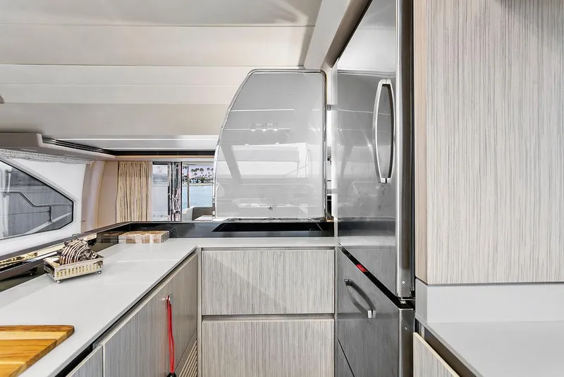 Slide: The Image of Modern kitchen interior of 2020 Azimut 66 yacht with sleek cabinetry and appliances. - 23