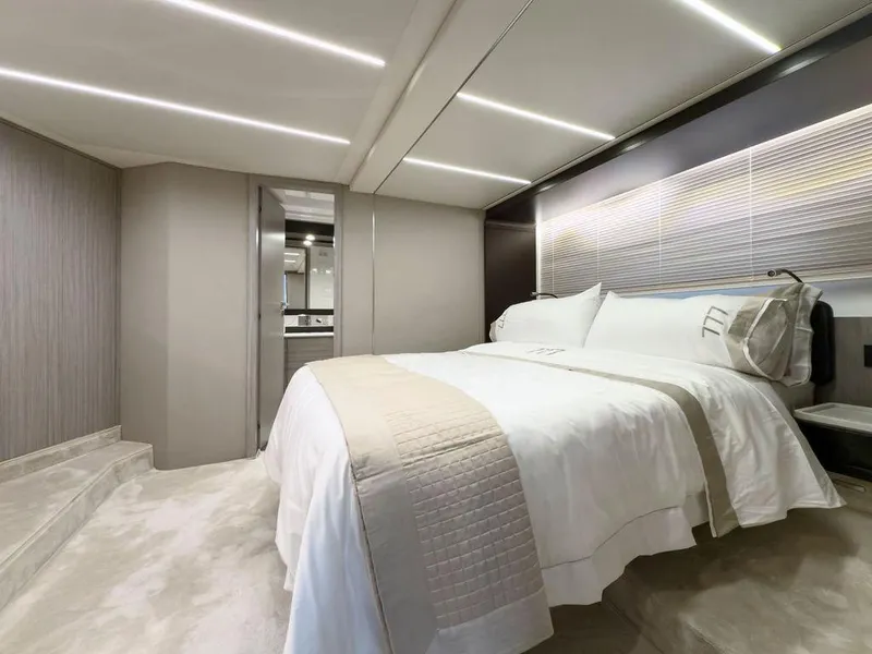 Slide: The Image of Luxurious bedroom interior of 2020 Azimut 66 yacht with modern design and elegant bedding. - 25