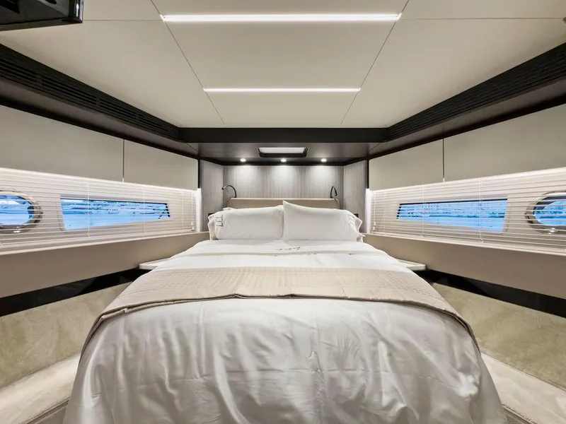 Slide: The Image of Luxurious bedroom interior of 2020 Azimut 66 yacht with modern design and elegant bedding. - 35