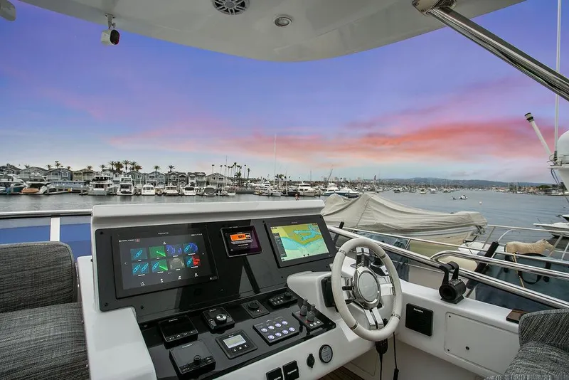 Slide: The Image of Cockpit view of 2020 Azimut 66 yacht at marina during sunset. - 8