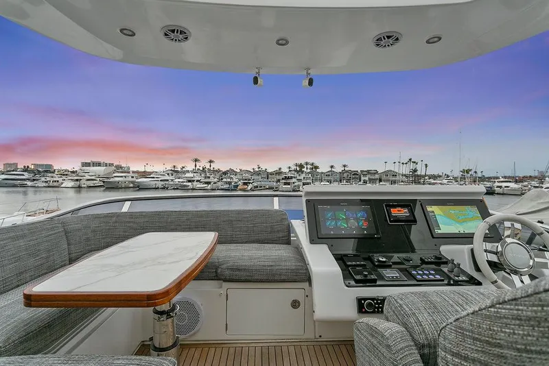 Slide: The Image of 2020 Azimut 66 yacht helm with marina view at sunset. - 9