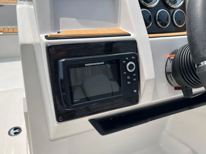 Slide: The Image of 2025 Starcraft SVX 211 OB boat dashboard with Humminbird navigation system. - 8