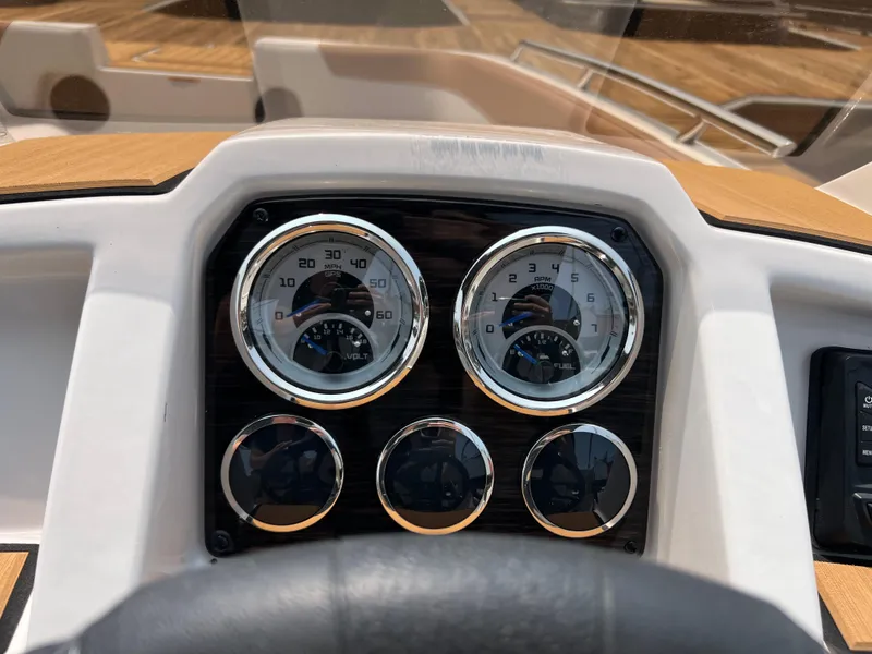 Slide: The Image of Dashboard of 2025 Starcraft SVX 211 OB boat with gauges and controls. - 9