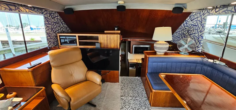 Slide: The Image of Luxurious interior of 1987 Ocean Yachts 48 Super Sport with plush seating and elegant decor. - 21