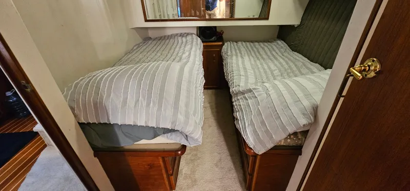 Slide: The Image of Bathroom interior of 1987 Ocean Yachts 48 Super Sport, featuring sink, toilet, and storage cabinets. - 37