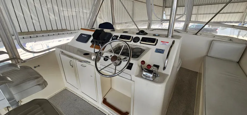 Slide: The Image of 1987 Ocean Yachts 48 Super Sport helm with steering wheel and navigation equipment. - 46