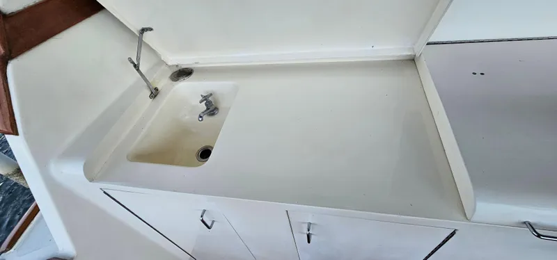 Slide: The Image of Control panel of a 1987 Ocean Yachts 48 Super Sport boat with wooden accents. - 18