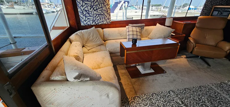 Slide: The Image of Interior of 1987 Ocean Yachts 48 Super Sport with dining area and seating. - 22