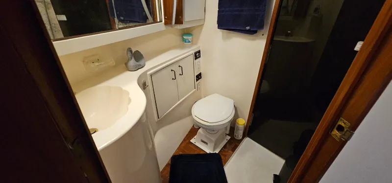 Slide: The Image of Twin beds in a cozy cabin of a 1987 Ocean Yachts 48 Super Sport. - 35