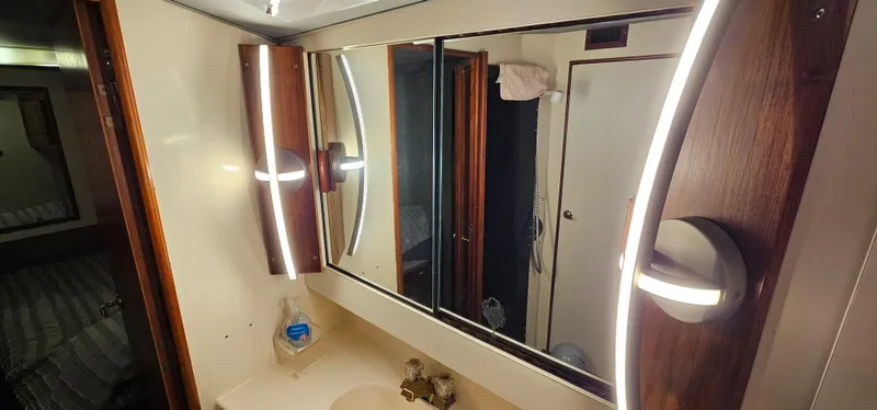 Slide: The Image of Interior of 1987 Ocean Yachts 48 Super Sport with wooden desk and leather chair. - 40