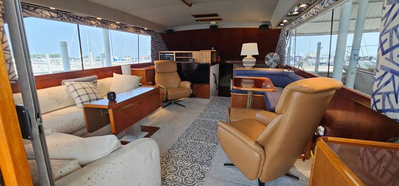 Slide: The Image of 1987 Ocean Yachts 48 Super Sport helm with steering wheel and control panel. - 45