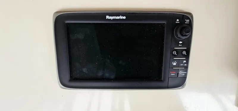 Slide: The Image of Control panel of a 1987 Ocean Yachts 48 Super Sport with navigation equipment. - 48